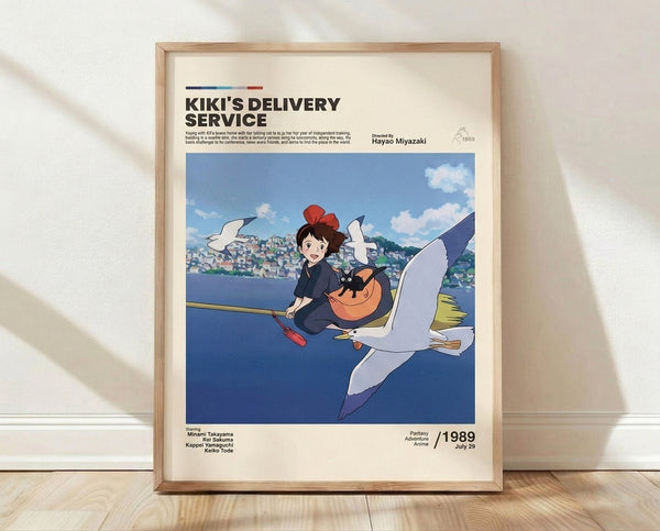 Whimsical anime poster featuring a young girl with her black cat and bird companion flying over a charming seaside town under a cream and blue sky, capturing the adventurous spirit of Studio Ghibli's beloved film.
