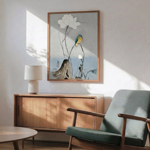 Wabi-sabi inspired wall art featuring a contemplative kingfisher amid white lotus and branching leaves in soft cream, pale blue, and muted gray tones.