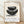 Minimalist framed poster featuring a cream ceramic bowl with charcoal and gold kintsugi repair lines, embodying wabi-sabi philosophy and the beauty of imperfection.