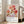 Philosophical watercolor poster of flowering cherry branch adorned with gold leaf, blending deep rose, cream, and olive green tones.
