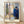 Framed impressionist poster depicting an intimate couple kissing by a window, rendered in deep blues, warm ochres, and muted greens with a melancholic, emotionally charged mood.
