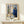 Impressionist-style wall art capturing an intimate window-side embrace between two figures in deep blue and ochre hues, conveying quiet emotional depth.