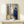Framed poster of an intimate window scene with two figures in soft focus, rendered in muted palette evoking quiet nostalgia and tender emotion.