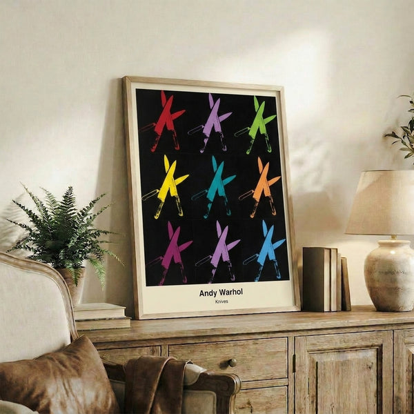 Pop art poster of repeated knife shapes in stark black and silver against white, with red accents, reflecting on repetition and darker themes.