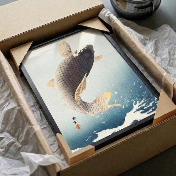 Contemplative Japanese woodblock-style framed poster of an elegant koi fish in motion, rendered in soft cream, blue, and gold tones.
