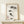 Elegant Japanese-inspired framed poster with a single koi and water lilies rendered in meditative monochrome brushwork and fine line details.
