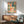 Serene botanical poster blending art nouveau and japandi aesthetics with koi and lotus motifs in coral, navy blue, sage green, and gold on an off-white ground, hung as wall decor.