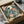 Peaceful wall art depicting koi fish among floating lotus flowers beneath the moon in classic Japanese woodblock and Art Nouveau style, featuring rich cream, gold, teal blue, and forest green tones.