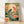 Serene Japanese woodblock-style poster depicting koi fish swimming among lotus flowers and lily pads beneath a full moon, rendered in cream, sage green, coral red, and golden yellow tones.