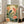 Framed poster art showing koi fish gliding through a tranquil lotus pond under a luminous full moon, combining Showa-era Japanese artistic techniques with cream, coral, and golden hues.