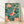 Serene Japanese woodblock-style framed poster depicting koi fish swimming among lotus flowers in a tranquil pond, rendered in teal, coral red, gold, and navy tones.