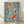 Framed Japanese woodblock-style poster depicting two koi fish swimming among flowing waves in sage green, red-orange, and pale blue tones with black linework on cream background.