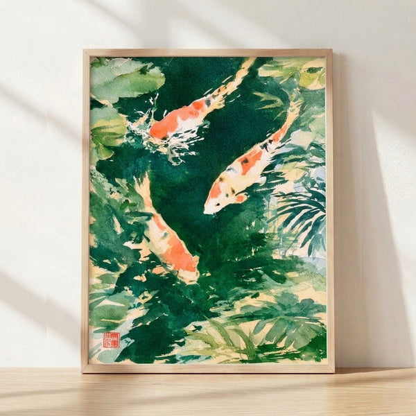 Serene watercolor koi pond painting in Japanese style, featuring coral and charcoal fish swimming among sage green lily pads and forest foliage on soft cream background, framed on wall.