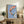 Tranquil koi fish artwork in traditional woodblock-inspired style with sophisticated palette of blue, coral, and sage, evoking a zen garden atmosphere.