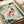 Vintage-style wall art of koi fish and water lilies in a minimalist Japanese design, dominated by peaceful dusty blue and coral orange with sage green, creating a calming zen atmosphere.