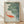 Serene Japanese woodblock-style framed poster featuring koi fish and lily pads in a pond, rendered in sage green, coral red, and soft blue-gray tones with minimalist composition.