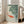 Peaceful water scene poster featuring ornamental koi fish and water lilies, rendered as a woodblock-inspired print with serene palette of cream, coral, and cool blue-gray hues.