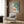 Meditative Japandi-style poster art showing koi fish among lily pads in a pond setting, combining woodblock print aesthetics with a soothing palette of muted greens and soft blues.