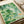 Minimalist watercolor poster depicting koi among water lilies with soft cream and sage green palette accents, creating a calming meditative focal point for any room.