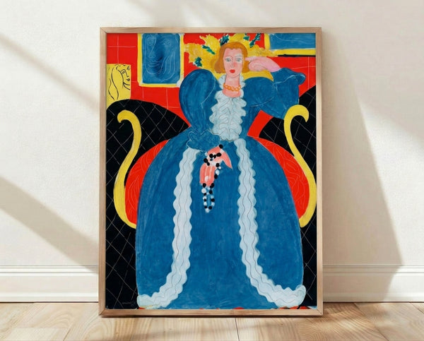 Framed Matisse poster featuring an elegant woman in a vibrant blue dress, rendered in the artist's characteristic bold lines and flat color planes against a warm, patterned background.