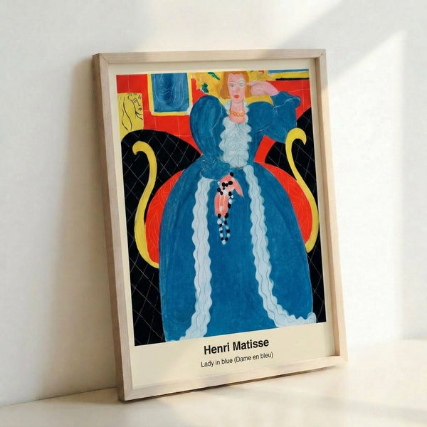 Matisse-inspired framed artwork depicting a woman gazing toward a blue seascape through an interior doorway, surrounded by stylized green palms and warm earth tones with decorative pattern elements.