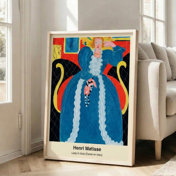 Contemplative wall art print with a blue-robed woman in an elegant interior space, abstract door frame opening to coastal view, palm motifs, and a palette of gold, terracotta, and cream.