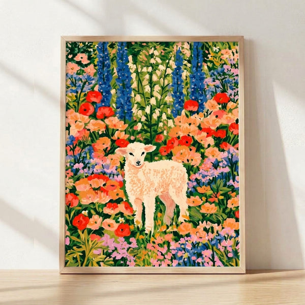 Framed boho cottagecore poster of a serene lamb surrounded by vibrant wildflowers in red, coral, and pink tones with cobalt blue and forest green accents, evoking a peaceful garden meadow.
