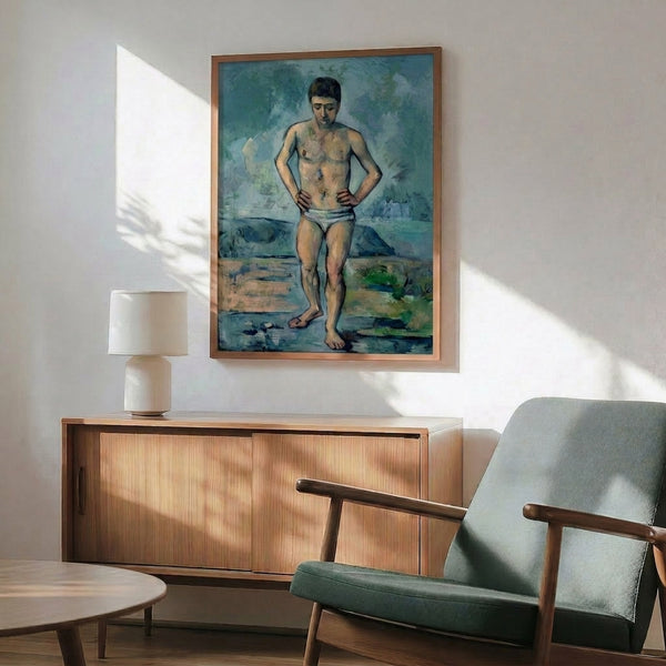 Watercolor landscape painting of a reclining figure in warm neutral colors, displayed as a framed classic art poster on the wall.