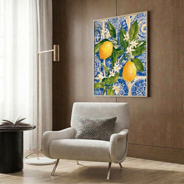 Cheerful botanical watercolor painting of golden lemons and florals with flowing Art Nouveau curves displayed in a frame on the wall, rendered in blues and soft yellows.