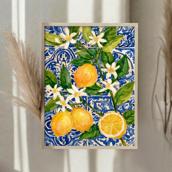 Elegant botanical watercolor print showing yellow lemons paired with soft white and pale blossoms, surrounded by verdant leaves on a sophisticated cobalt backdrop, hung as modern wall decor.