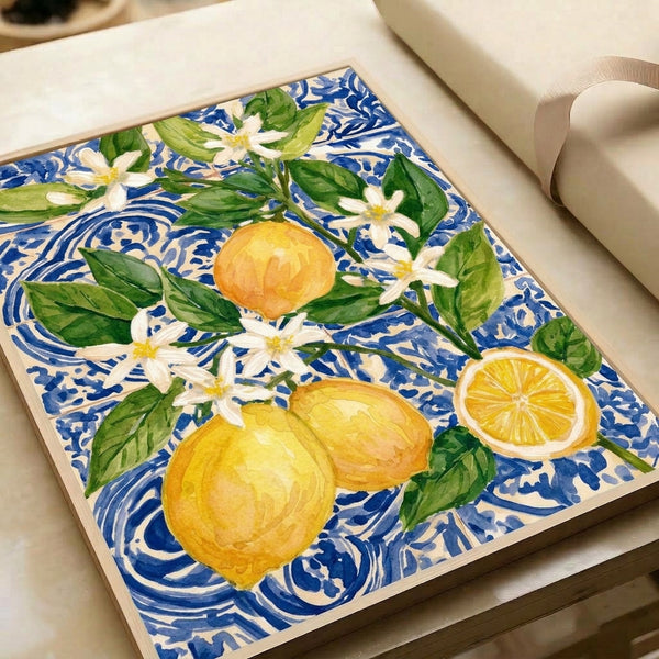 Framed nature-inspired artwork in muted boho style depicting lemons and garden flowers in cream and yellow tones with lush green accents on a serene blue ground.