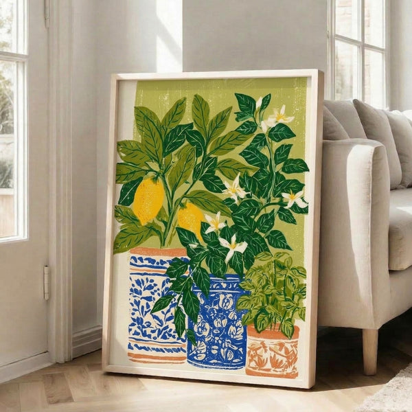 Japandi-inspired kitchen art print featuring a lemon plant with vibrant yellow fruit and foliage in muted green tones, displayed in a coral-trimmed pot on a soft cream wall.