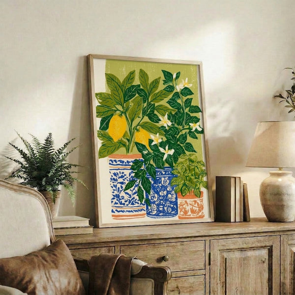 Retro botanical wall art of a potted lemon tree with golden citrus and sage green leaves, rendered in a calm Japandi aesthetic with warm, domestic appeal.