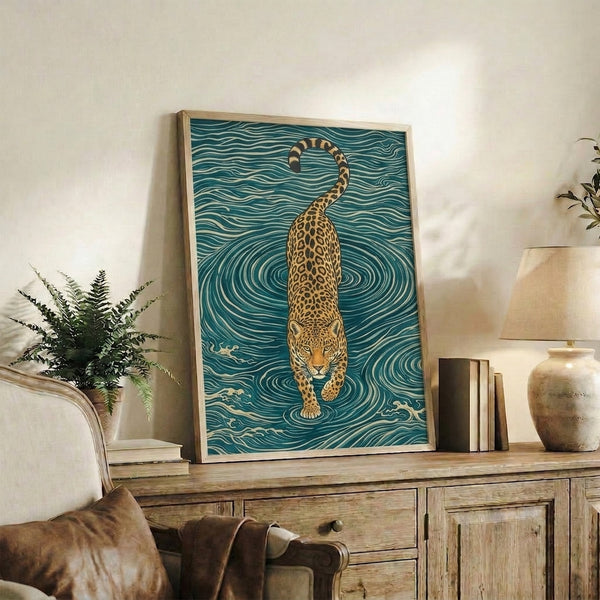 Framed minimalist poster depicting a solitary leopard amid flowing, swirling waters in teal and cream, inspired by Japanese woodblock traditions and rendered with contemplative, fluid line art.