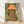 Retro pop art poster featuring a quirky leopard peeking out from behind a teal green lamp with an orange hat, rendered in folk art style with cream and black accents.