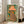 Quirky wall art print with a whimsical leopard character partially hidden behind a retro lamp, wearing an orange hat, in bold pop art and folk art style with teal green and cream colors.