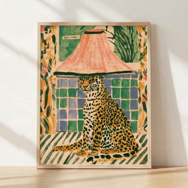 Framed boho wall art print featuring a whimsical leopard peeking out from a tent surrounded by potted plants, rendered in retro style with warm coral, green, mustard, and cream tones.