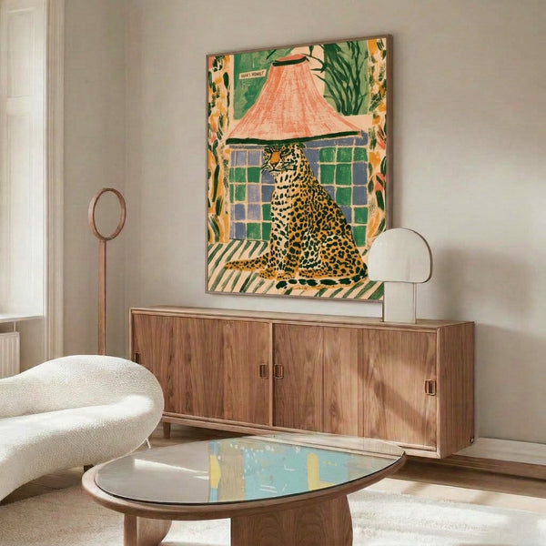 Vintage-inspired framed art depicting a playful leopard partially hidden behind a tent with interior plants, featuring whimsical boho design in mustard, green, coral, and slate blue.