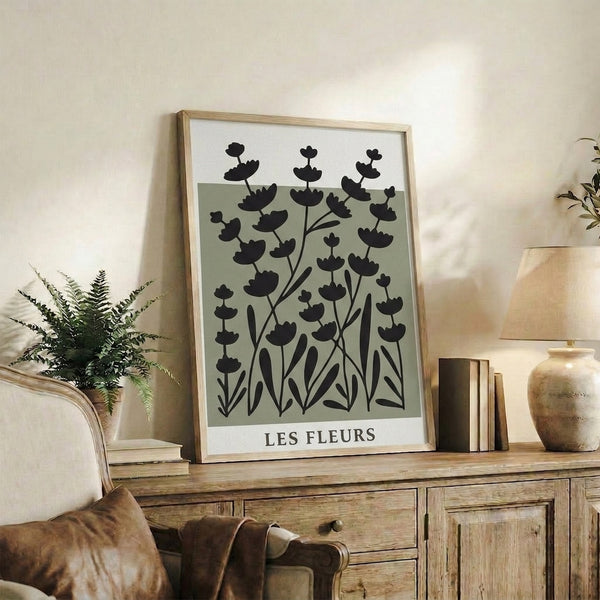 Minimalist nature poster featuring botanical elements in sage green and black on pale background, calm japandi style framed print.