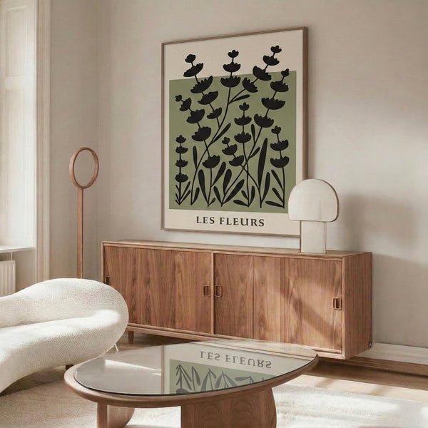 Calm botanical print with understated flower and leaf design in sage and black tones, framed minimalist zen garden aesthetic.