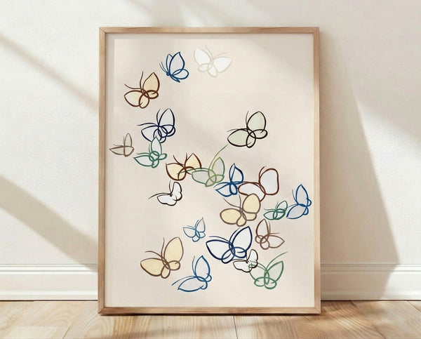 Minimalist line art poster featuring delicate butterflies and flowers in navy blue, sage green, and warm brown strokes on a cream background, framed on a wall.