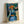 Impressionist art print depicting a little girl with her doll companion, featuring translucent watercolor layers and a quiet, intimate atmosphere on a gallery wall.