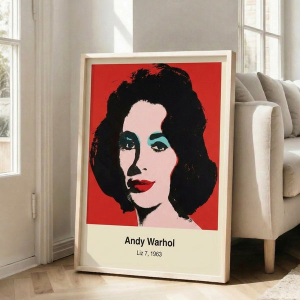 Bold pop art portrait print displaying a woman's face in luminous magenta and cyan with yellow highlights, embodying iconic mid-century modern style.