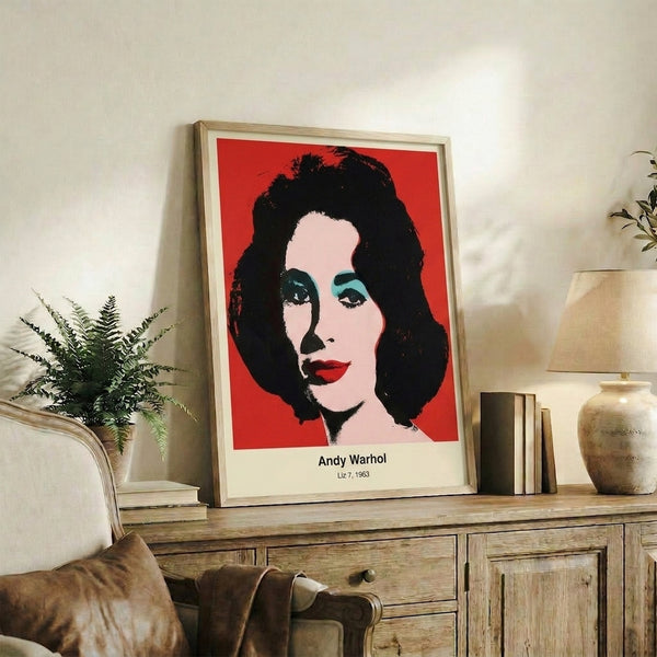 Pop art wall print featuring a stylized portrait in vivid magenta, electric blue, and yellow tones with dramatic black line work and minimalist composition.