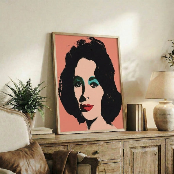 Vibrant pop art poster of Elizabeth Taylor with striking color separations in hot pink, azure blue, and yellow creating a contemporary portrait suitable for modern home décor.