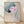 Serene watercolor framed poster depicting a pink lotus flower with a songbird perched nearby, rendered in soft teal, cream, and sage green tones in Japanese artistic style.