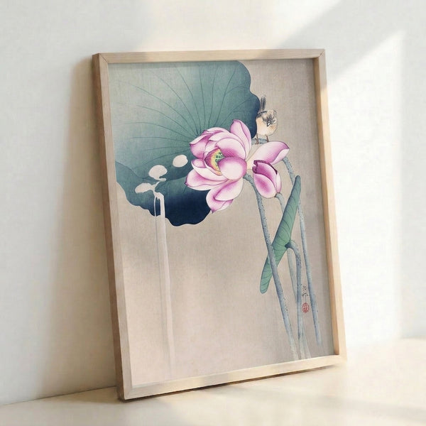 Framed Japanese-inspired watercolor print showing a graceful lotus with a songbird, composed in soft cream, sage green, and teal pigments with a meditative aesthetic.