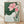 Serene Japanese woodblock print of a pink lotus blossom with green stems and leaves, rendered in soft dusty pink, forest green, and cream tones, framed as botanical wall art.