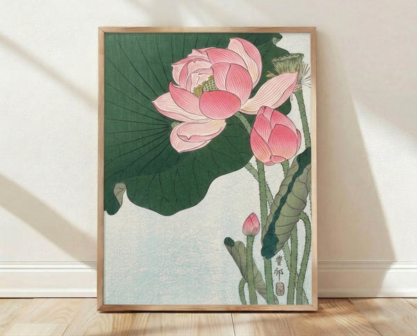 Serene Japanese woodblock print of a pink lotus blossom with green stems and leaves, rendered in soft dusty pink, forest green, and cream tones, framed as botanical wall art.