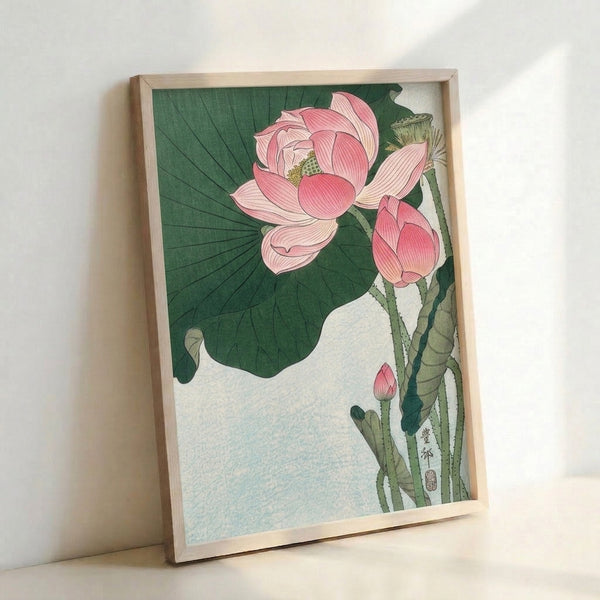 Contemplative Japanese woodblock artwork showcasing a blooming lotus amid flowing stems and leaves in a harmonious palette of dusty pink, cream, and forest green.